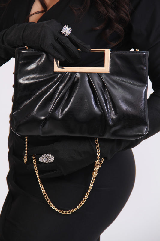 BOLSO NEGRO RECTANCULAR PLANO AGARRADERA RECTANGULO DORADO